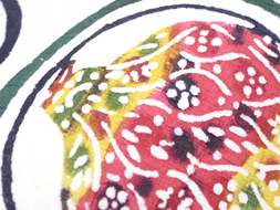 丸紋に野菜の柄型絵染紬名古屋帯　国画会会員　小島悳次郎作